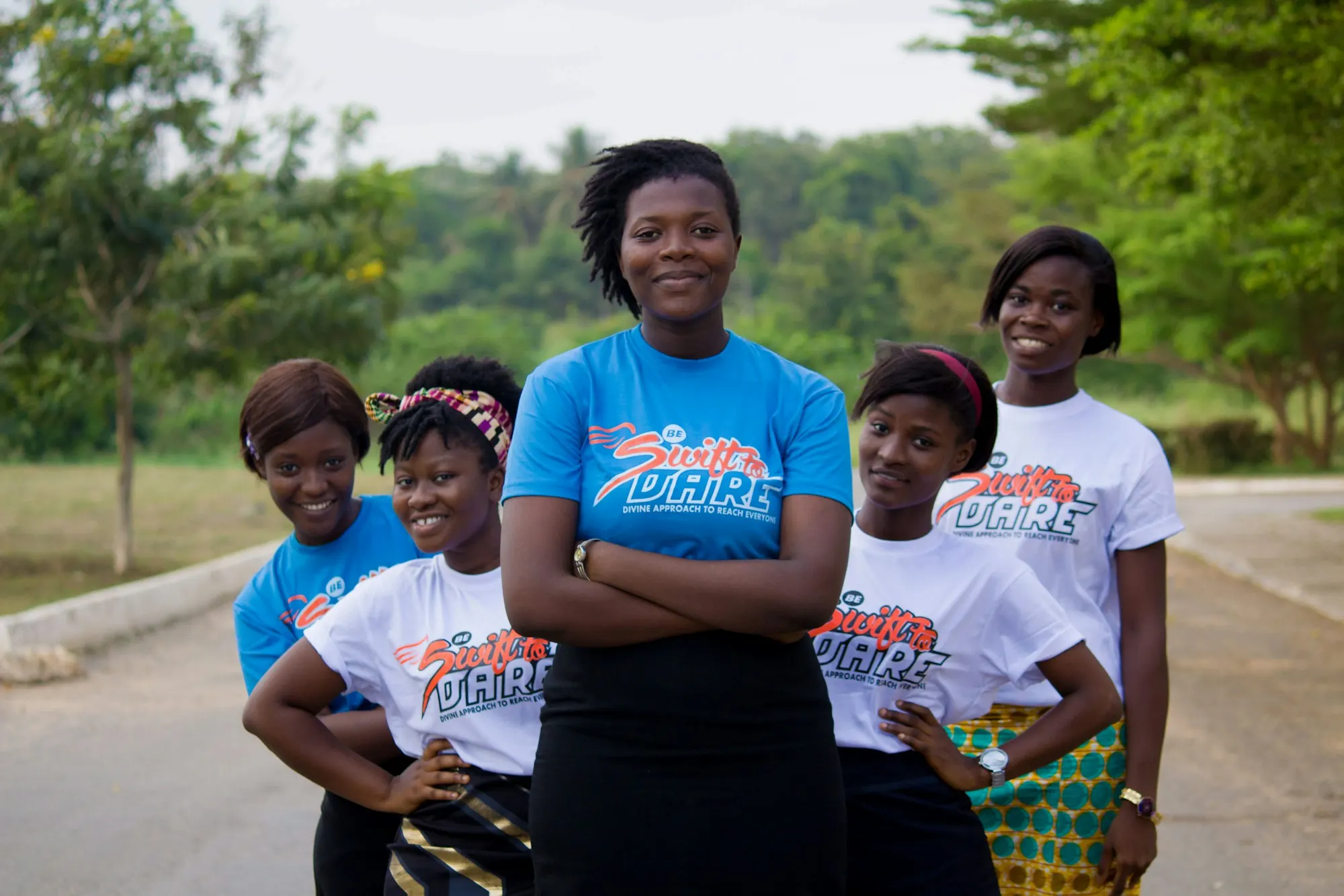 Group of confident young women standing together outdoors